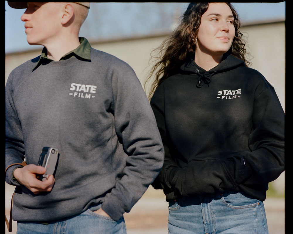Two team members in State Film sweatshirts